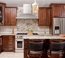 Fabuwood Cabinets Style: Deep Serenity Door Style: Allure Fusion Chestnnut with island and breakfast bar